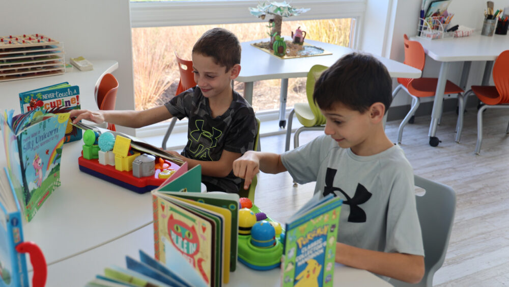 Two kids playing at Kids' Corner Childcare inside Techny Prairie Activity Center